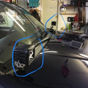 The light PODS are mounted on the hood on each side.