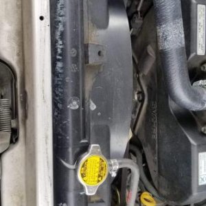 Mysterious Coolant leak in top panel of radiator.