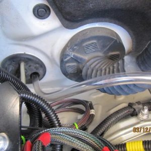 IM
Used a clear rubber water tube cut at a sharp angle to fish through the grommet into the passenger side foot well G 6224