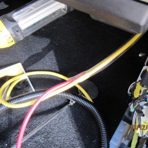 IM
Using the clear tube  insert the cable into the tube then pull the tube back out wire should remain in tube while pulling through grommet G 6225