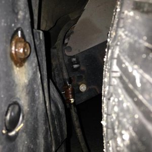This is my relocated A/C drain hose. Brought it from engine compartment where it drained right on top of frame to rear of pass side front wheel well w