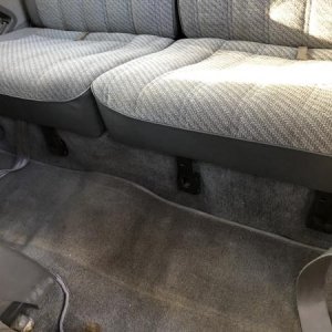 1988 Grey clean backseats.  Original carpet protected by heavy duty rubber matt