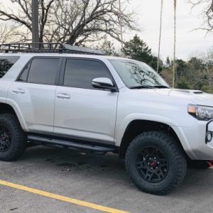 Done a few simple mods to change the stock look.  

- Running boards
- Wheels and tires
- Roof rack
- Tint
- Shackles
- Debadged
- Hood scoop black de
