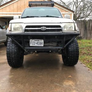 Stance with 35s, Also front bumper. Zoom in and look at my c channel protecting my radiator. Had the entire front end sitting on that on a rock and sa