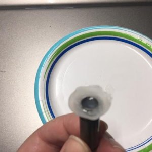 After dipping, rubber dripped down to form a "gasket" of sorts.