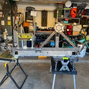 Coastal Offroad rear bumper with custom made swingarms. Swingarms completed. Used an old Rotor for the tire mount.