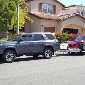 the Rhino pulling an Aluma 7814R trailer with a Lotus Exige S aboard