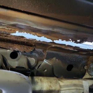 Water damage from improper roof rack installation—my fault. Front driver-side inside