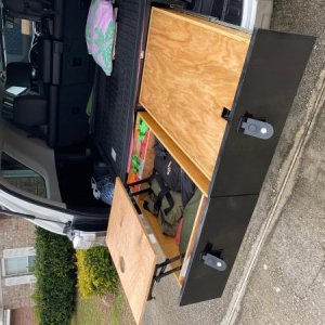 final product. coffee table has a cut out for a tumbler and workspace. The right drawer has a simple cover to serve as a table / makeshift changing st