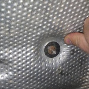 Muffler heat shield fixed with fender washers.