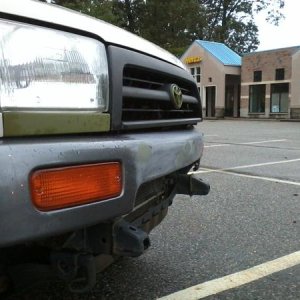 comparing bumper with alignment of headlights.