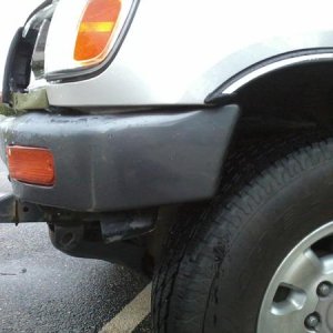 Bumper pushed back. Turn signal plastic cracked.