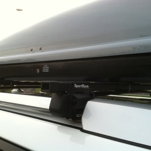 SportRack crossbars w/ Thule Evolution 1600XT cargo carrier. Was a tight fit to get the holding brackets on. Had to bend the brackets as well to screw