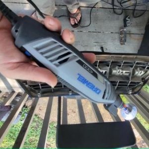 I used a Dremel, don't. Use a jigsaw.