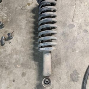 Driver's side coilover removed to replace the lower bushing.