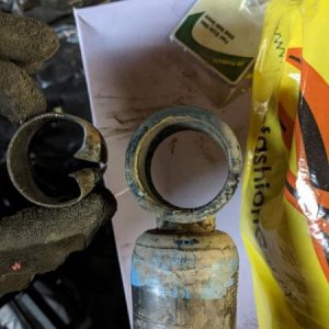 I don't own a press. After much effort, I was finally able to remove the old bushing. I used a c-clamp to press out the inner metal ring, a drill pres