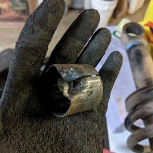 Another pic of the metal collar that surrounded the old bushing. I cut straight through it with the hacksaw to make a relief and then bent it away fro