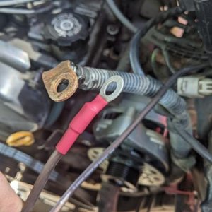 The other two wires that I connected to the positive battery terminal. The larger ring terminal is the original power wire, and the smaller 10-gauge w