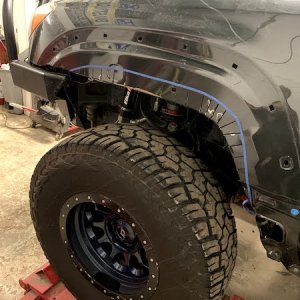 Still needed more room to help clear the 35's. Cut the fender and flare roughly 1.5" and bolted the flare on