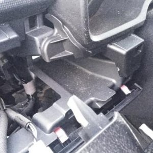 Garage door opener hidden tray