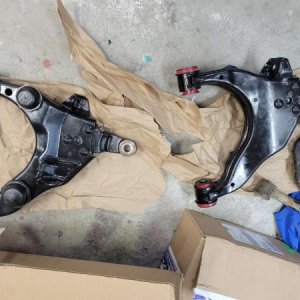 Lca's with the Energy Suspension poly bushings installed, with my old uca's right in the pic