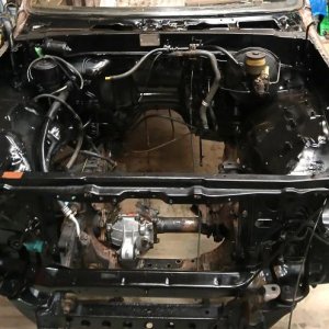Engine bay mostly gutted, cleaned, and painted gloss black.  Frame and suspension components will be satin black.