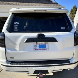 Plasti Dip of back chrome “4Runner” emblem with ABS Toyota symbol; Plasti Dip of chrome strip on bumper; black lens taillights with running sequence t