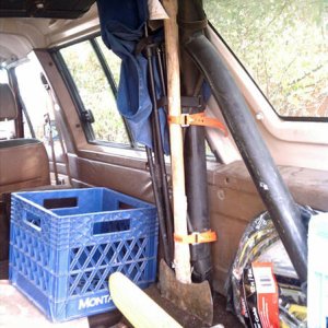 Axe and shovel (not shown) are attached to the roll cage using rubber "ski straps".  A camping chair is also attached but with velcro attachments inst