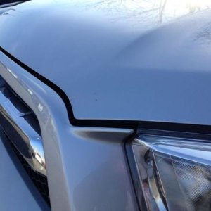 Chip on front of hood (center of photo)