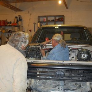 Bro and a friend helping out.  We had to remove the wheels and drop the truck onto blocks for better access.