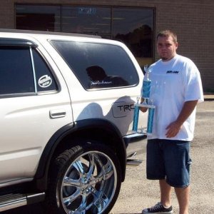 outside pick after show holding trophy
