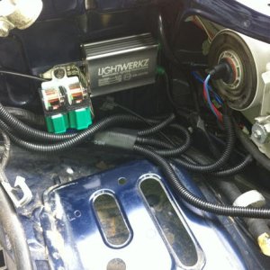 Battery removed driver side pic of the wire harness, also were I mounted the relays and one of the ballast for the HID's.