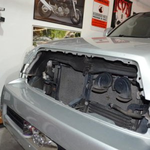 1st step, get the grille off the car