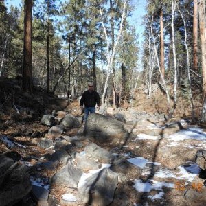 My brother behind one of the boulders on the heavy-hitter portion of the trail.