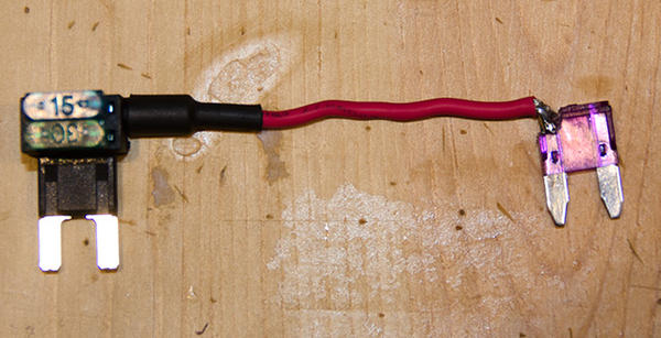 12v Mod Fuse expander connected to a fuew that has had the fuse wire removed so it is now just a plug.