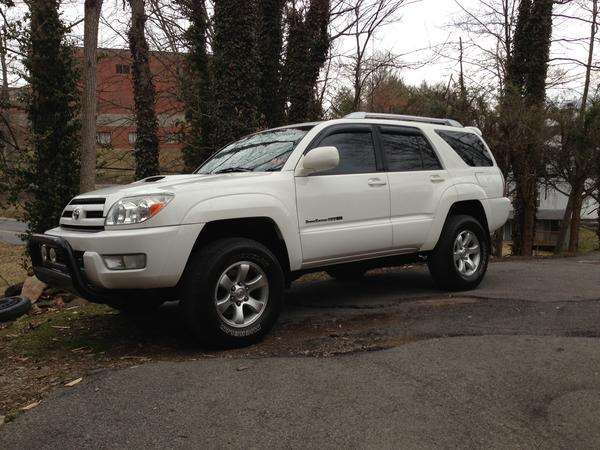 2 1/2" Leveling kit, 1 1/2" wheel spacers (soon to get XD Black Spy rims) front bull bar w/lights, K&N filter, new exhaust, 32" tires.  CD/DVD player 