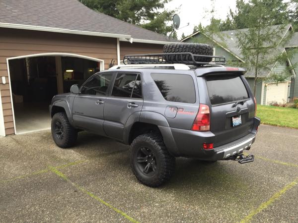 285/70/17 spare tire with stock spare rim on there until I get a new set of wheels so I can get 5 to match, plus the step on the hitch to move it when