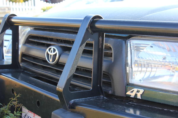 4r cut from rear "4runner" badge. Plasti Dipped grill black. Tacoma ARB bumper