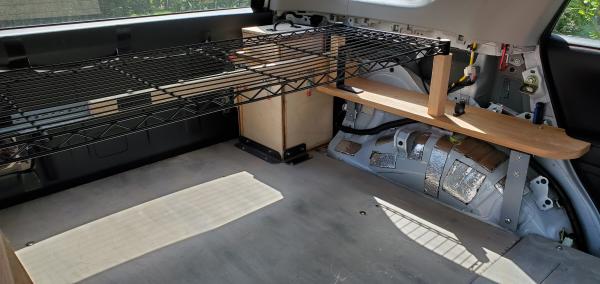 4Runner shelf - driver's side. The propane locker is in the rear corner. Two 1 1/2" x 1 1/2" oak legs to support the black vinyl-coated wire shelf are