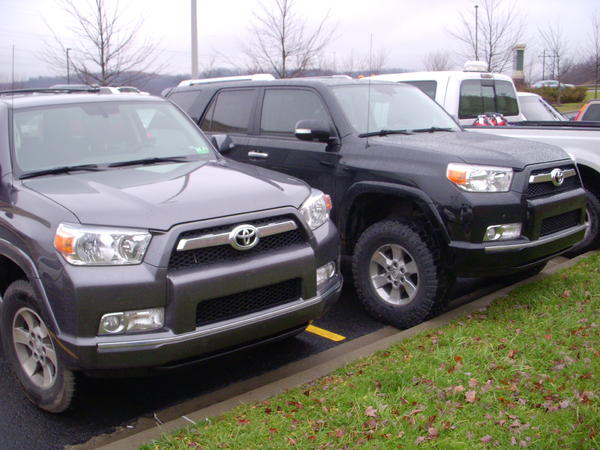 5'' higher in the front with the OW lift and 285's
