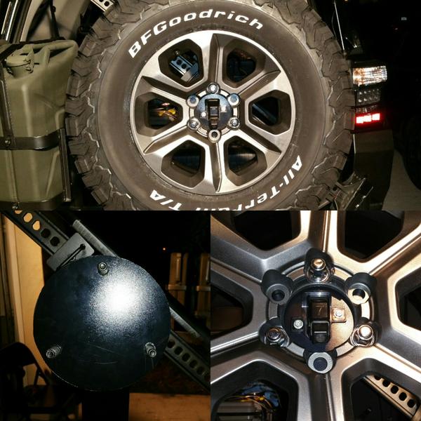 A little late night innovation as we relocate the rear view camera to the spare tire swing arm... the black plastic piece is actually a sheet of kydex
