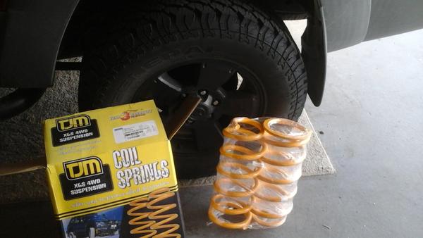 Adding tjm rear HD coils to suspension. Gained 2 inches of lift over stock coils and daystar rear spacer