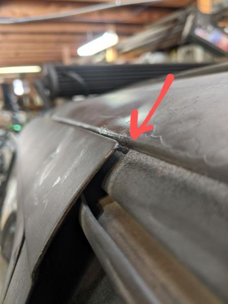 After bending the driver's side door back into place.