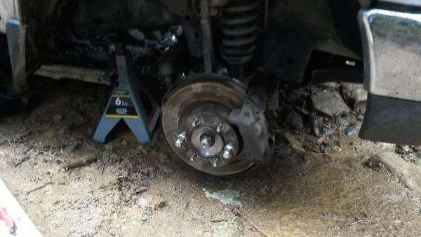 After reassembly, my hub was this close to the ground. Dug a hole and put the wheel back on!