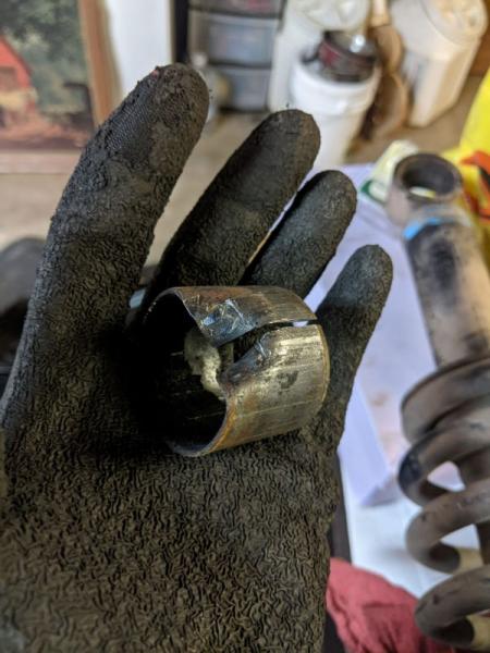 Another pic of the metal collar that surrounded the old bushing. I cut straight through it with the hacksaw to make a relief and then bent it away fro