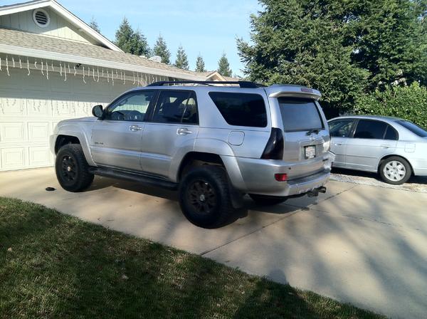 Another picture of her lifted with the blacked out taillights and emblems.  Really enjoying the new toy.