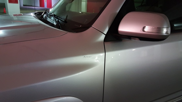 Anyone know what to do about this? Its a small scratch and really the only flaw on the vehicle. It's very deep.