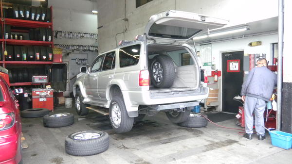 At Big O Tires waiting for my 2007 FJ 17 inch Wheels to be mounted on. You can see the new wheel on the floor. Nice!