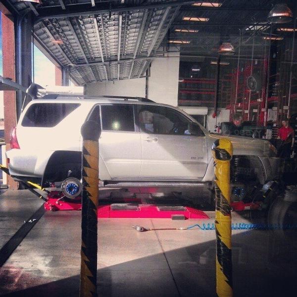 At Discount Tires mounting FJ wheels and up sizing from 265/65-17 to 265/70-17.