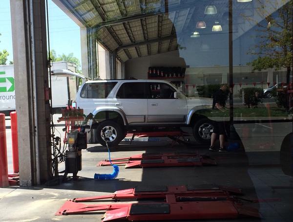 At the tire shop getting the new wheels and rubber installed